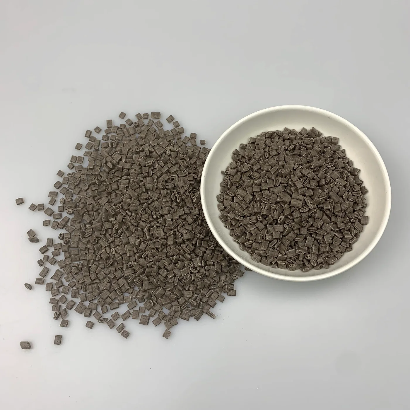 Coffee grounds composite ABS brown pellets in bowl