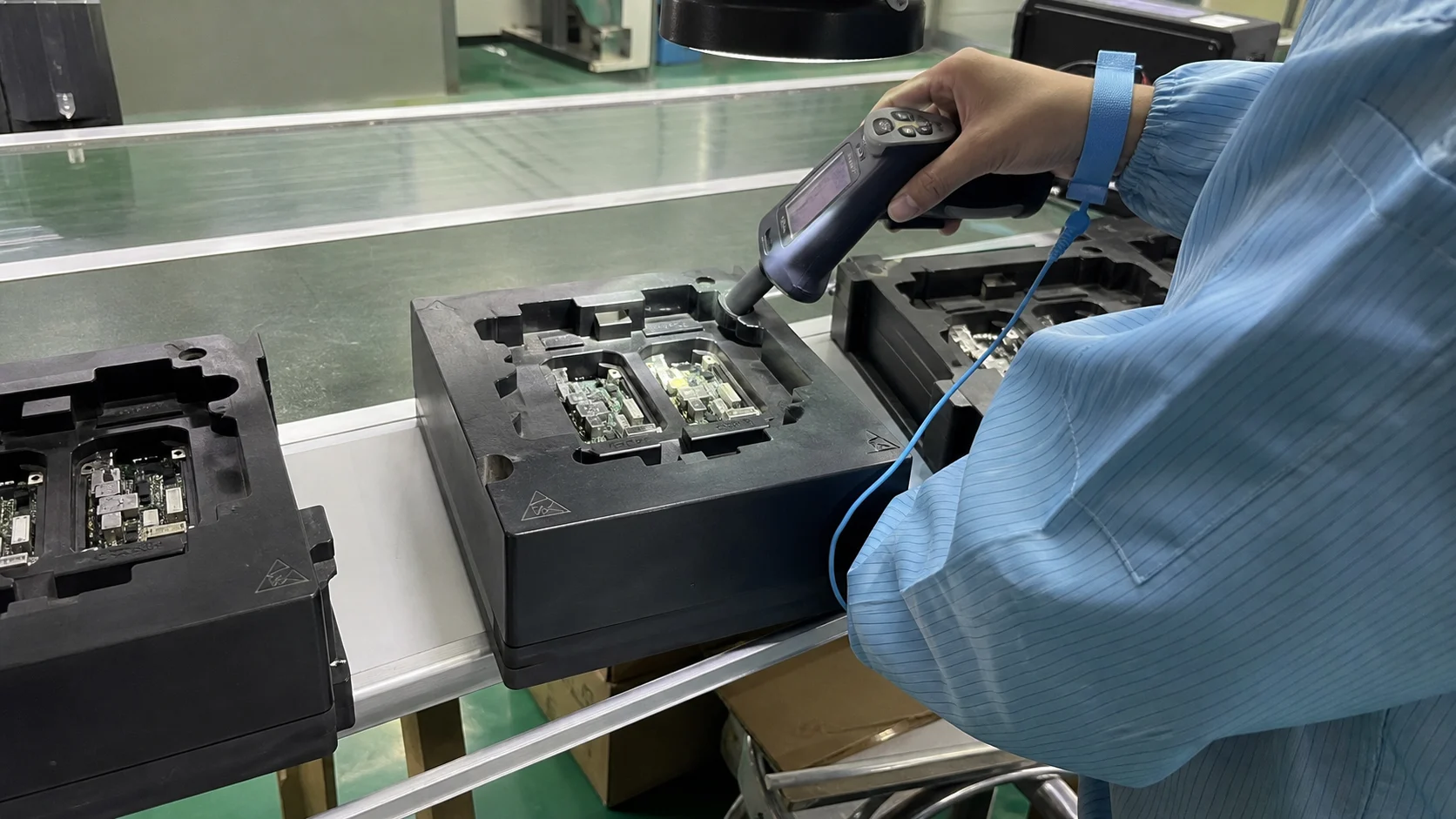 Real electronics assembly validation scene using conductive ABS fixtures and an electrostatic field meter